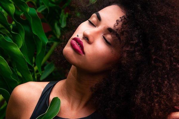 Woman Wearing Halter Top Near Green Leafed Plants